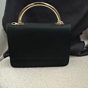 Elegant Black Handbag with Gold Handle